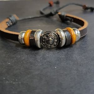 Leather like bracelet with charms